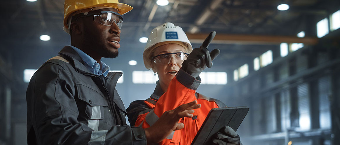 State Fund safety manager assisting supervisor on work floor